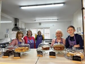 volunteers at Clent Connect show off their baking and cakes
